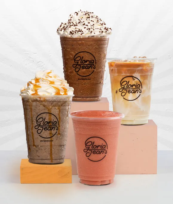 Four Gloria Jean's Chillers topped with cream and caramel